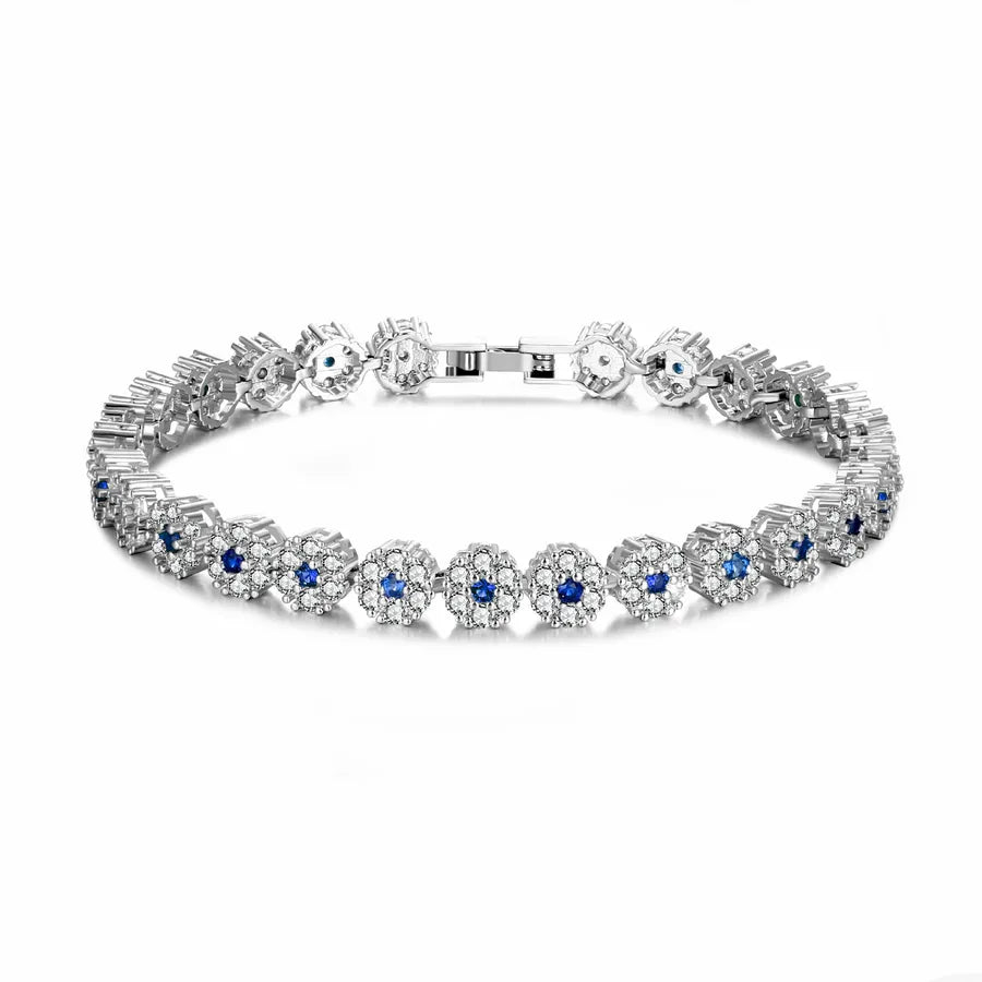 Diamond bracelet with blue stones on a white background