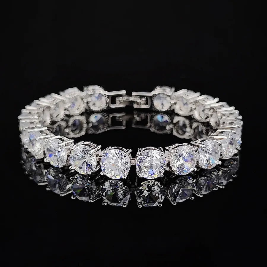 Silver bracelet with clear gemstones on a black background
