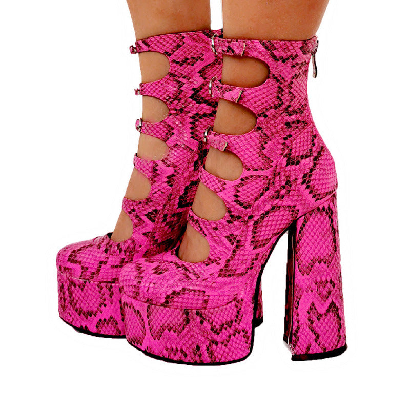 Pink snake print platform high heels on a white background