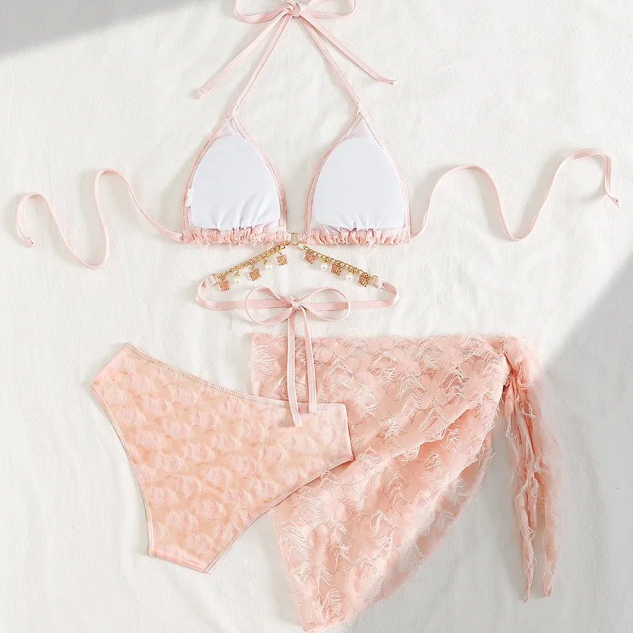 Pink lace bikini set on a white background.