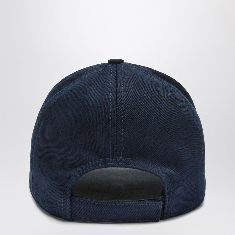 Navy blue baseball cap on a light gray background