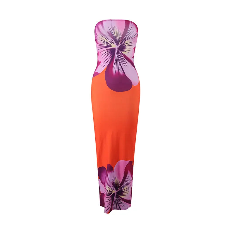 Floral strapless dress with orange and pink design on a white background. Vacation resort dress