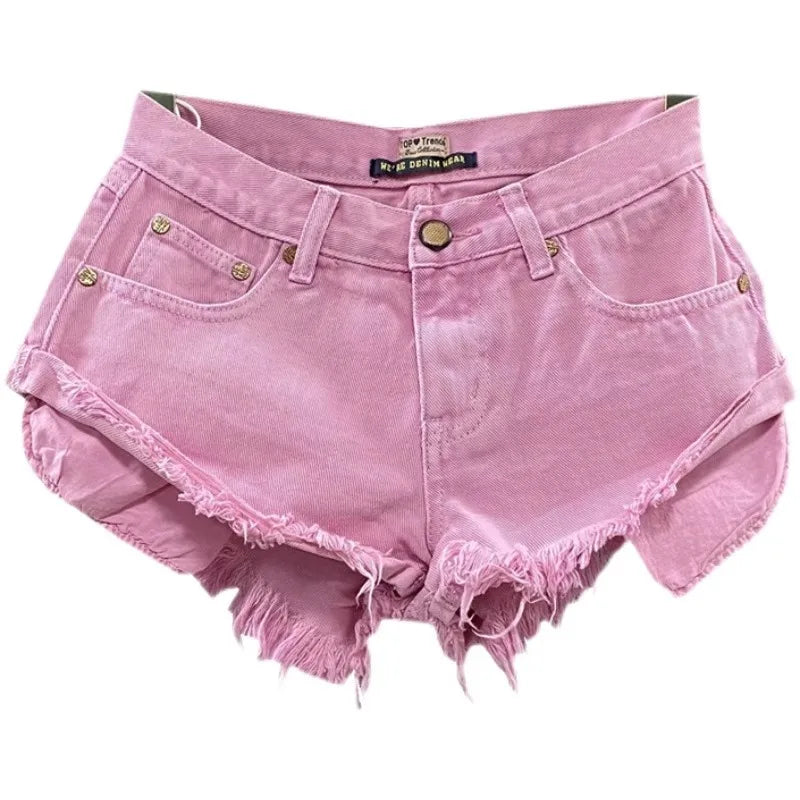 Pink denim shorts with frayed edges on a white background