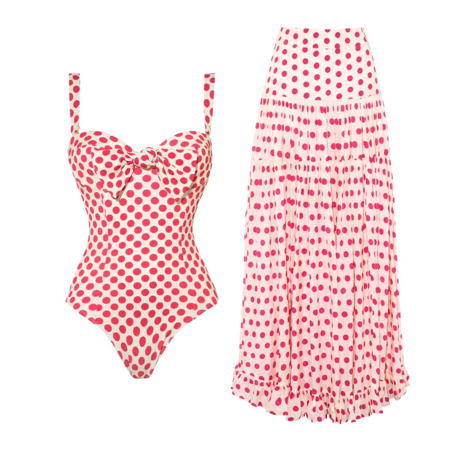 white swimsuit with hot pink polka dots. A set pictured with one swimsuit and one white swimsuit with hot pink polka dots