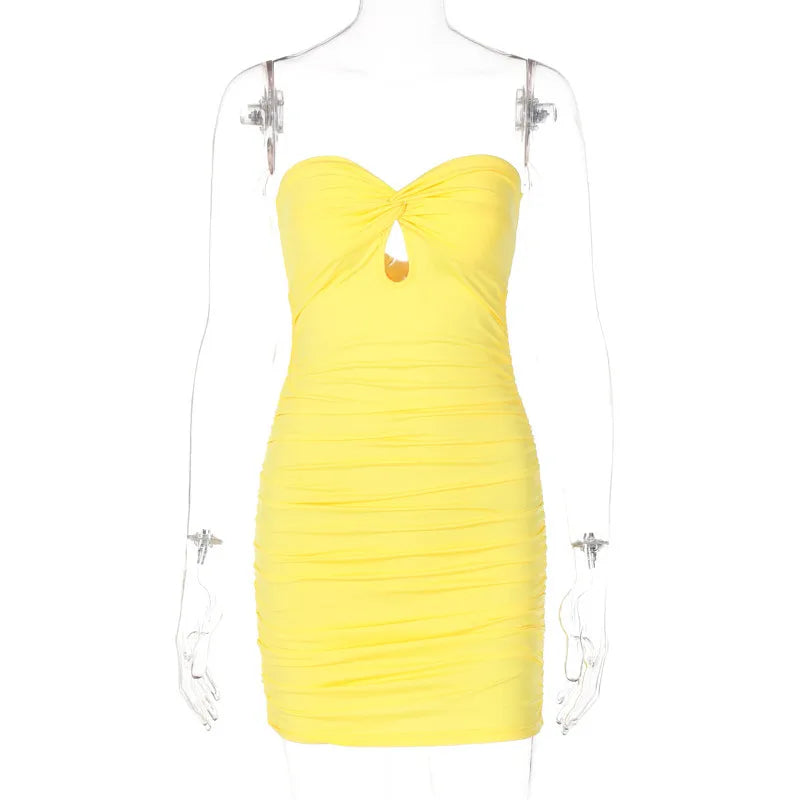 Yellow strapless dress on a mannequin against a white background