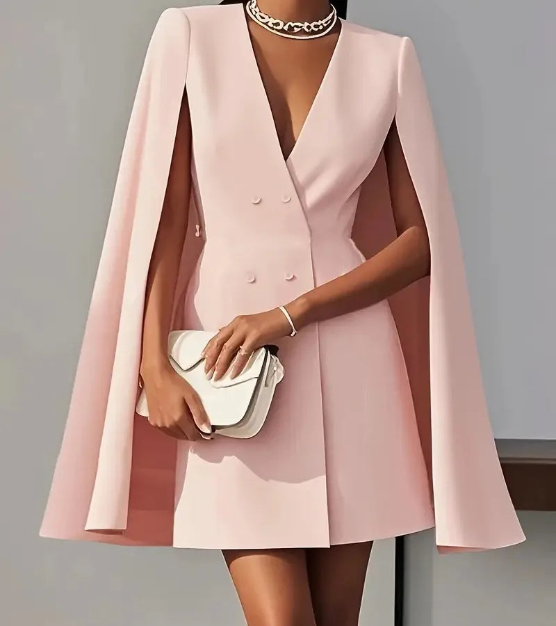 Pink cape dress worn by a model against a neutral background. Light Pink Blazer Coat Dress in Blush Dust