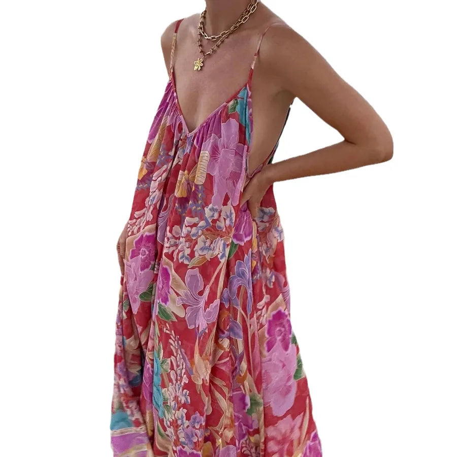 Woman wearing a colorful floral dress on a white background