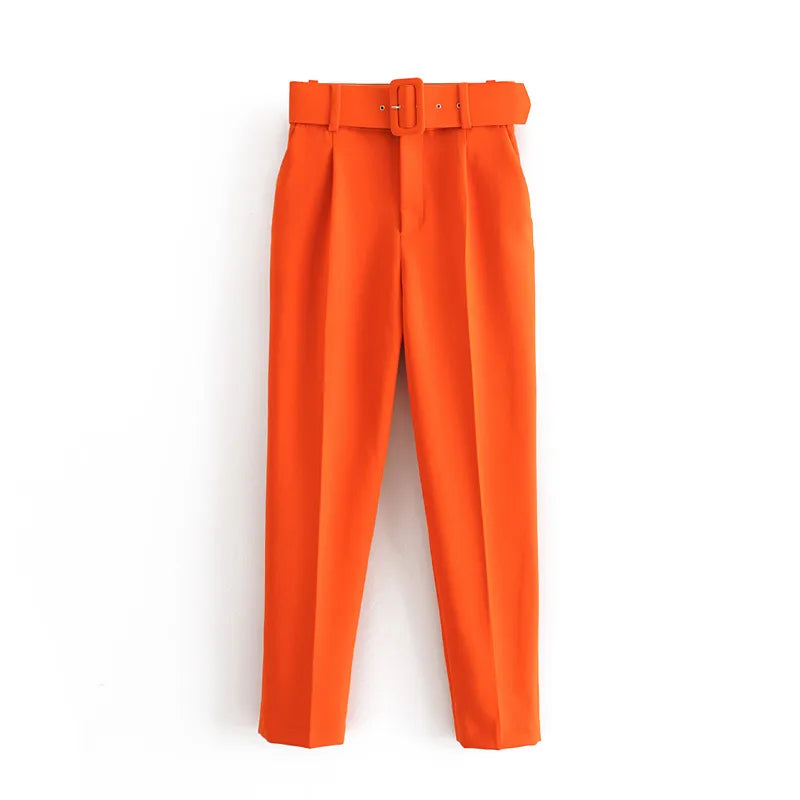 Orange pants with a belt on a white background high waisted pants women, pleated trousers women, ankle length pants, slim fit trousers, business casual pants, work pants women, office trousers, women's dress pants, casual chic outfit, tailored pants women, everyday trousers, spring fashion women, autumn pants women, elegant trousers, commuter style fashion, women's workwear, high rise pants, fashion trousers women, travel pants women, versatile wardrobe essentials