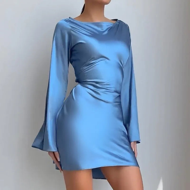 Blue satin dress with long sleeves on a plain background