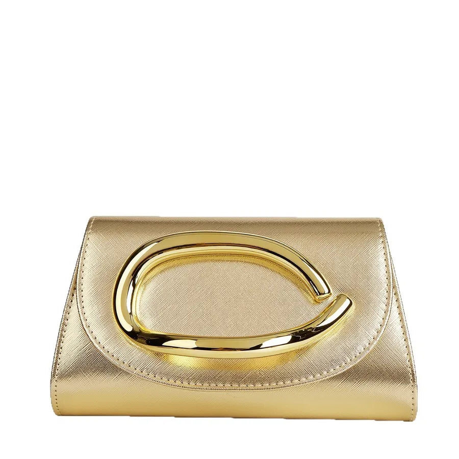 Gold clutch bag with a prominent handle on a white background