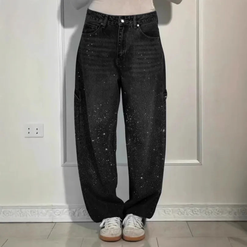 Person wearing black jeans standing against a light-colored wall. rhinestone jeans women, sparkly jeans, crystal jeans, bling denim pants, embellished jeans, high waisted jeans women, star jeans, rhinestone denim, designer inspired jeans, glam jeans, streetwear jeans women, trendy denim pants, fashion jeans women, statement jeans, luxury denim, straight leg jeans, commuter style fashion, women's denim pants, sparkle jeans, casual glam outfit