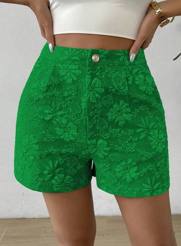 Green lace shorts worn by a person on a neutral background high waisted shorts women, jacquard shorts, vintage shorts women, boho shorts, summer shorts women, boutique shorts, woven shorts women, resort wear women, vacation outfit women, chic summer shorts, elegant shorts women, festival outfit women, high rise shorts, trendy summer fashion, casual chic outfit, bohemian shorts, statement shorts women, women's fashion shorts, luxury summer style, boutique clothing women
