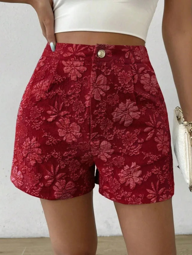 Red floral shorts worn by a person on a white background high waisted shorts women, jacquard shorts, vintage shorts women, boho shorts, summer shorts women, boutique shorts, woven shorts women, resort wear women, vacation outfit women, chic summer shorts, elegant shorts women, festival outfit women, high rise shorts, trendy summer fashion, casual chic outfit, bohemian shorts, statement shorts women, women's fashion shorts, luxury summer style, boutique clothing women