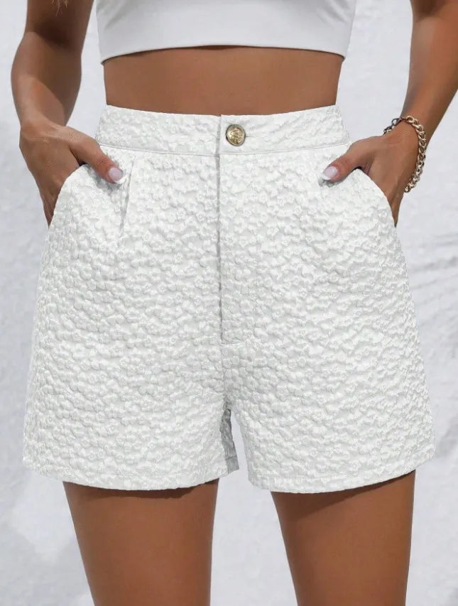 White textured shorts worn by a person on a white background high waisted shorts women, jacquard shorts, vintage shorts women, boho shorts, summer shorts women, boutique shorts, woven shorts women, resort wear women, vacation outfit women, chic summer shorts, elegant shorts women, festival outfit women, high rise shorts, trendy summer fashion, casual chic outfit, bohemian shorts, statement shorts women, women's fashion shorts, luxury summer style, boutique clothing women