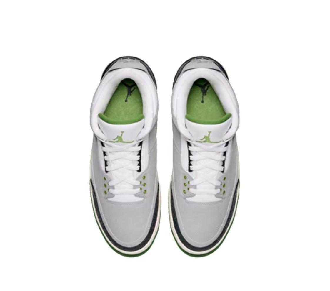 Pair of white Air Jordan 3 Retro 'Chlorophyll' sneakers with green accents on a white background