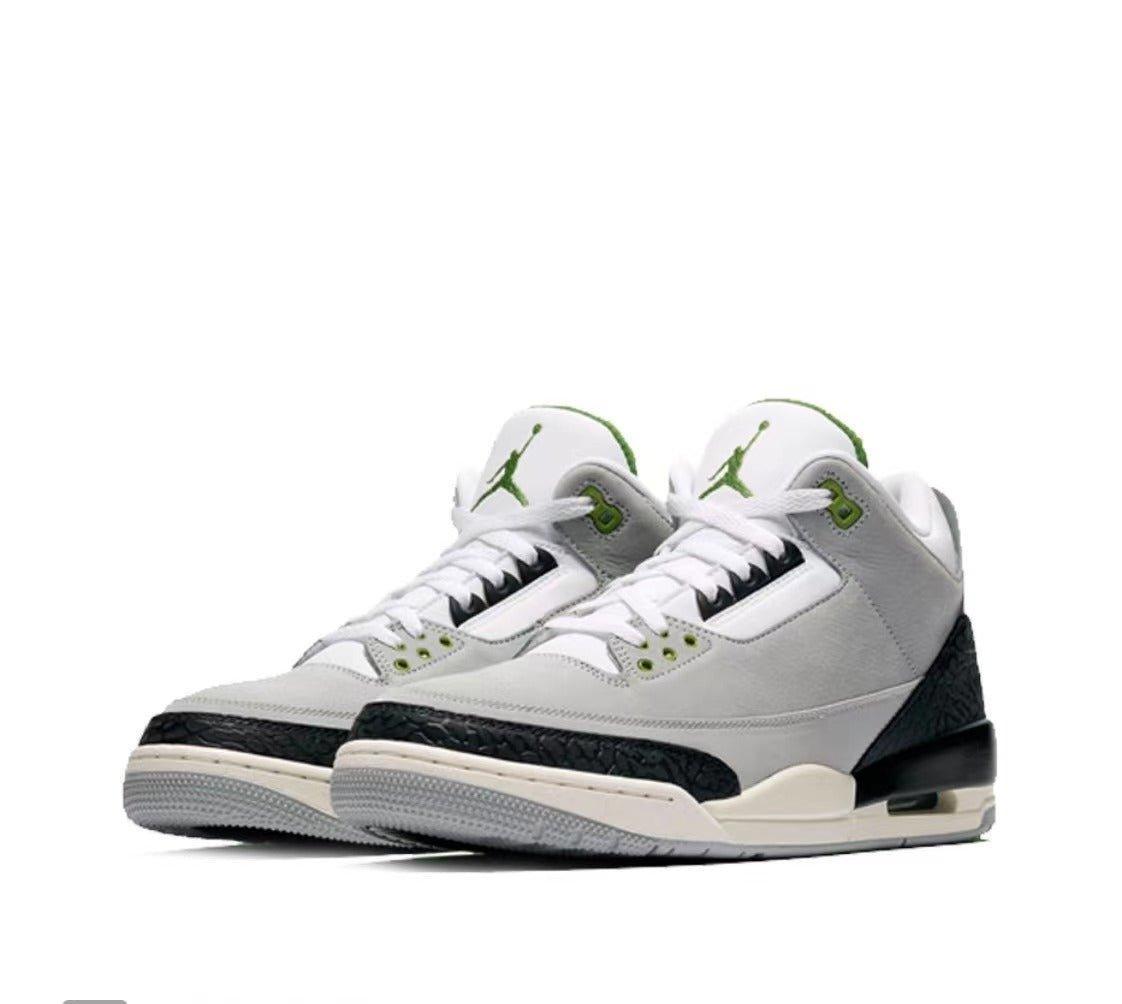 Pair of white Air Jordan 3 Retro 'Chlorophyll' sneakers with black and green accents on a white background