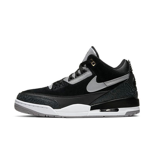Black and gray Air Jordan 3 Retro 'Tinker Black Cement Gold' sneaker with red accents on a white background