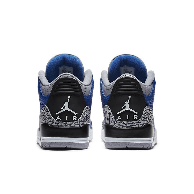 Pair of Jordan Air Jordan 3 Retro 'Varsity Royal Cement' sneakers with blue, black, and gray design on a white background