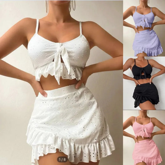 White eyelet top and skirt set with additional color options shown.