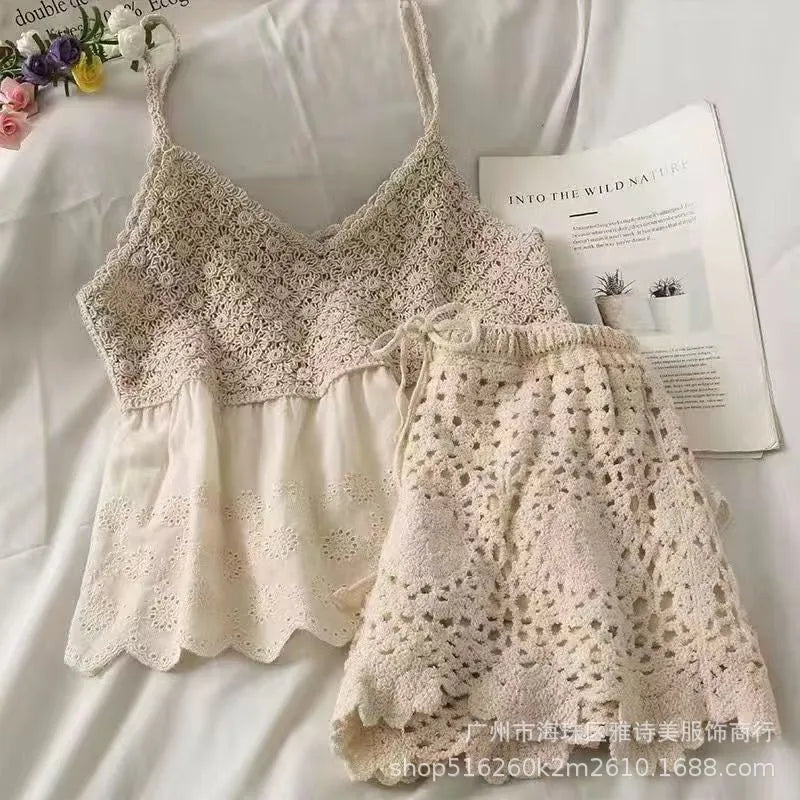 Lace top and shorts set on a white background with a magazine.