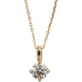 Gold necklace with a diamond pendant on a white background
