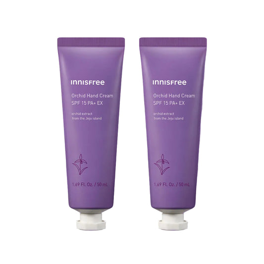 Two purple Innisfree Orchid Hand Cream tubes with white caps, displayed side-by-side on a matching purple gradient background.