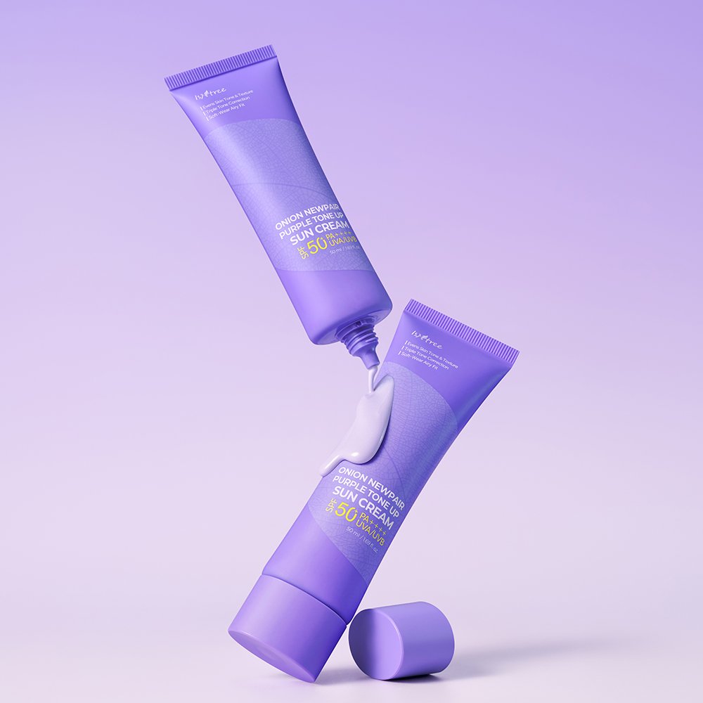 Two purple tubes of La'Poix Cushion Nourriscent Sun Cream and Peon Cream are arranged dynamically on a light lavender gradient background, with a dollop of white cream dripping from the top tube.