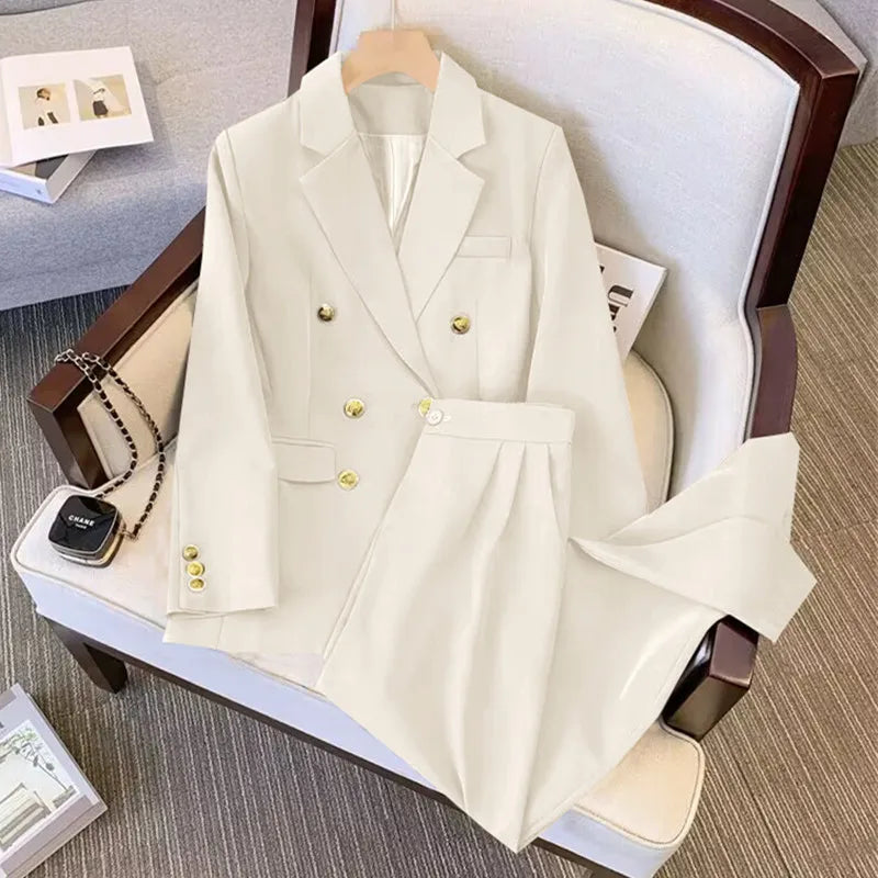 White suit jacket and pants on a chair with a minimal background