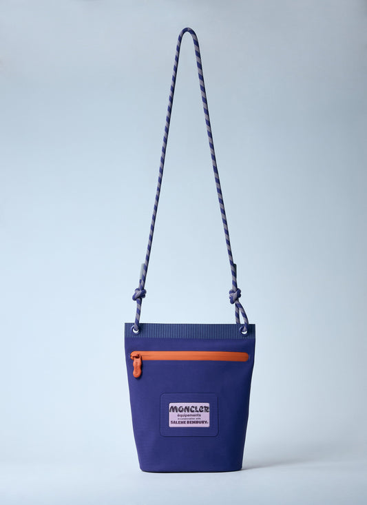 Blue bag with orange zipper and visible brand logo on a light gray background