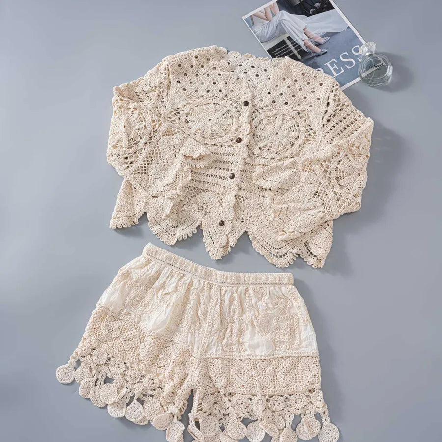 Beige lace top and shorts set on a gray background
