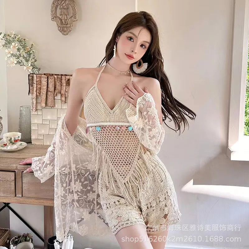 Woman wearing a lace outfit in a bright room with a desk and plants.