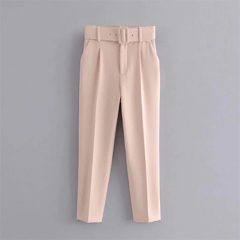 Beige pants with a belt on a gray background