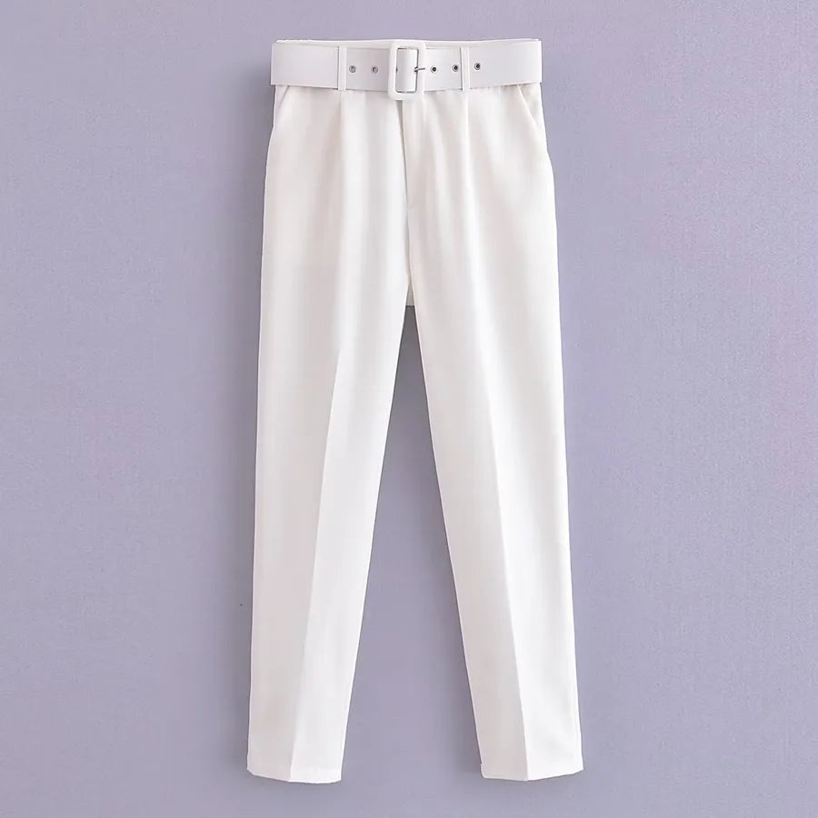 White pants with a belt on a light purple background