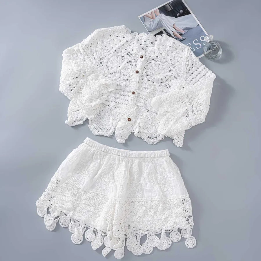 White lace top and shorts set on a gray background
