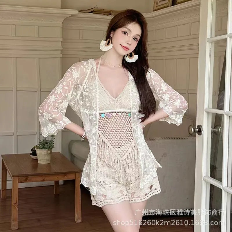 Woman wearing a white lace outfit in an indoor setting