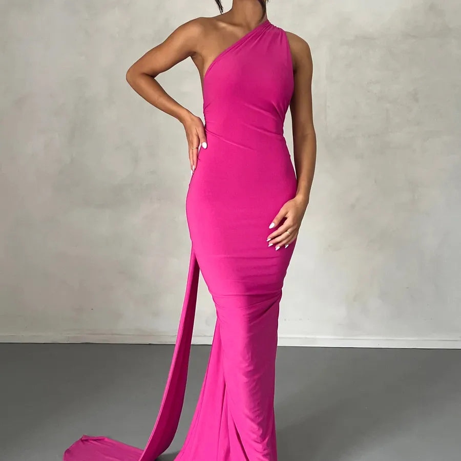 Pink one-shoulder gown with a slit on a neutral background