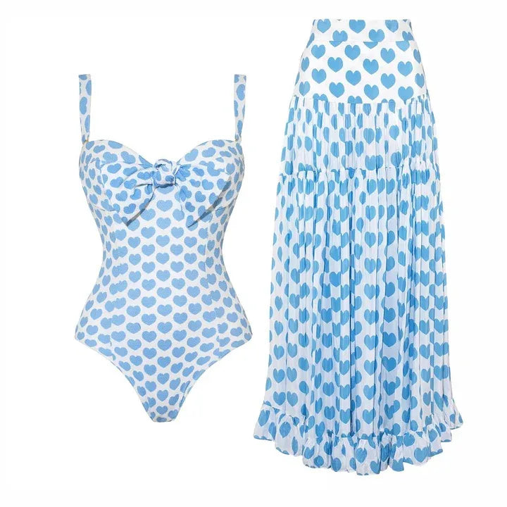 two piece swimwear set. One white bikini with light blue hearts pattern. Vacation swimsuit.