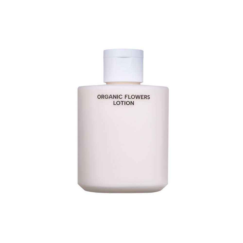 A matte off-white bottle of Organic Flowers Lotion with a matching cap, centered on a solid white background.