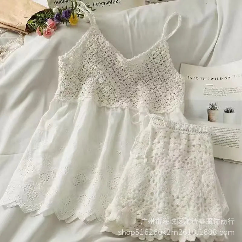 White lace top on a white background with flowers and text.